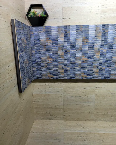 Textured blue relief wall tile with wood-look plank floor
